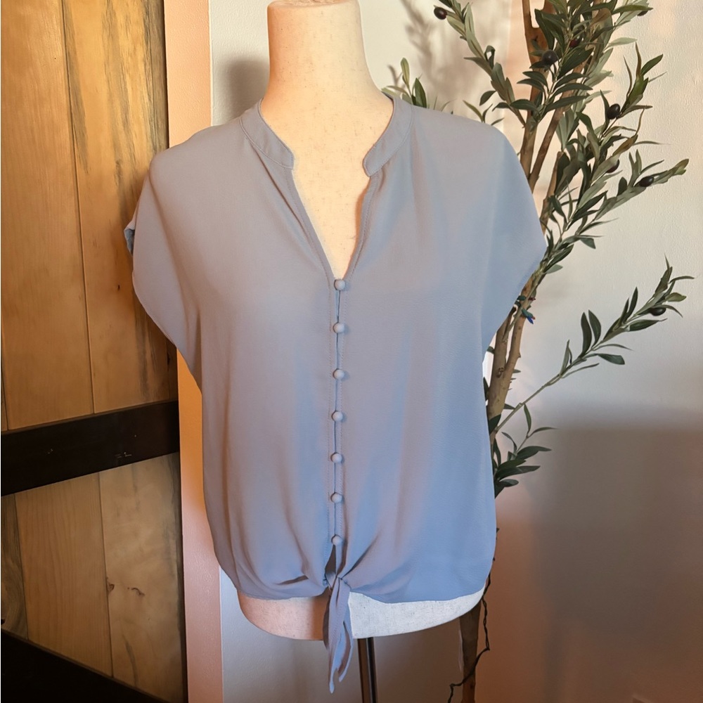 Light blue blouse shoe sleeve tie in the front size small